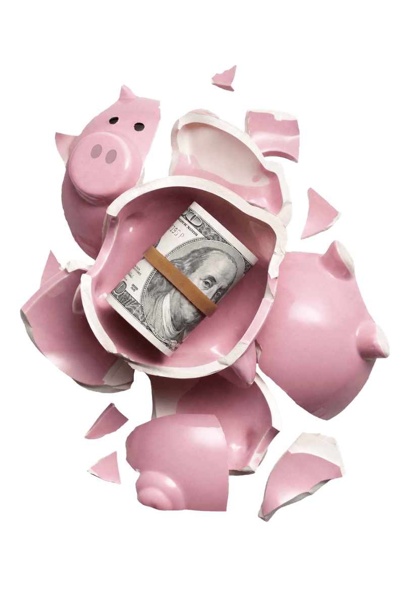 Broken pink piggy bank with a roll of cash